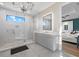 Stylish main bathroom features a glass walk-in shower with marble floors, a mirror, and a vanity at 6349 Isla Del Ray Ave, Sarasota, FL 34240