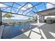 This waterfront pool features a screened enclosure, fountains, and ample patio space at 6349 Isla Del Ray Ave, Sarasota, FL 34240