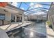 A stunning screened-in pool area with a relaxing spa and fountains, perfect for outdoor living and entertaining at 6349 Isla Del Ray Ave, Sarasota, FL 34240