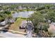 Aerial view of a single Gathering home near a pond and lush landscaping at 6572 Mauna Loa Blvd, Sarasota, FL 34241