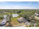 Aerial view of a single Gathering home near a pond and lush landscaping at 6572 Mauna Loa Blvd, Sarasota, FL 34241