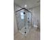 Modern bathroom featuring glass shower, gray and white tiling, and a new toilet at 6572 Mauna Loa Blvd, Sarasota, FL 34241