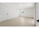 A bedroom with light wood floors, a bright window and white paint, creating a serene atmosphere at 6572 Mauna Loa Blvd, Sarasota, FL 34241