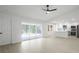 Bright and airy living room featuring vaulted ceilings, recessed lighting, and sliding glass doors at 6572 Mauna Loa Blvd, Sarasota, FL 34241