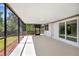 Enclosed patio with beautiful views of the green landscaped yard at 6572 Mauna Loa Blvd, Sarasota, FL 34241