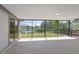 Enclosed patio overlooking a serene lake and lush greenery at 6572 Mauna Loa Blvd, Sarasota, FL 34241