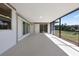 Screened-in patio with sliding glass doors overlooks the backyard at 6572 Mauna Loa Blvd, Sarasota, FL 34241