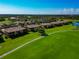Aerial view of community overlooking manicured lawns and beautiful ponds at 7106 Grand Estuary Trl # 102, Bradenton, FL 34212