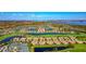 Stunning aerial view of the property surrounded by lakes and lush landscaping at 7106 Grand Estuary Trl # 102, Bradenton, FL 34212