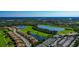 Expansive aerial view of the community displaying the lush landscaping, pristine golf course, and tranquil ponds at 7106 Grand Estuary Trl # 102, Bradenton, FL 34212