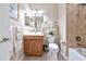 Bright bathroom features a vanity, toilet, and shower with tiled walls at 7106 Grand Estuary Trl # 102, Bradenton, FL 34212