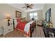 Bedroom with a comfy bed, window, and decorative furniture at 7106 Grand Estuary Trl # 102, Bradenton, FL 34212