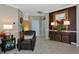 Elegant entryway featuring a leather armchair and decorative table with a mirror at 7106 Grand Estuary Trl # 102, Bradenton, FL 34212
