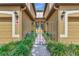 Home featuring a gated entrance and manicured landscaping at 7106 Grand Estuary Trl # 102, Bradenton, FL 34212