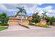 Charming home featuring a tile roof, brick driveway and lush landscaping at 7106 Grand Estuary Trl # 102, Bradenton, FL 34212
