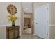 Hallway with a decorative table and a staircase leading to the lower level at 7106 Grand Estuary Trl # 102, Bradenton, FL 34212