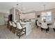 Bright, open kitchen features an island with seating and a breakfast nook with window views at 7106 Grand Estuary Trl # 102, Bradenton, FL 34212