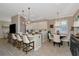 Bright, open kitchen features an island with seating and a breakfast nook with window views at 7106 Grand Estuary Trl # 102, Bradenton, FL 34212