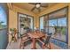 Covered lanai features outdoor seating, golf course views, and easy access to the interior at 7106 Grand Estuary Trl # 102, Bradenton, FL 34212