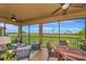 Spacious screened lanai featuring both living and dining spaces, ideal for enjoying outdoor meals and relaxing at 7106 Grand Estuary Trl # 102, Bradenton, FL 34212