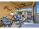 Relaxing screened lanai offering comfortable seating, unique décor, and peaceful outdoor living at 7106 Grand Estuary Trl # 102, Bradenton, FL 34212