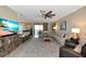 Spacious living room with bar seating, leading out to a screened lanai at 7106 Grand Estuary Trl # 102, Bradenton, FL 34212