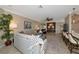 Inviting living room with neutral tones, comfortable seating, and a view of the kitchen at 7106 Grand Estuary Trl # 102, Bradenton, FL 34212