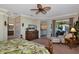 Spacious primary suite with bedroom, sitting area, and entry to bath and outdoor deck at 7106 Grand Estuary Trl # 102, Bradenton, FL 34212