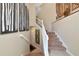 Home staircase featuring carpeted steps and neutral decor at 7106 Grand Estuary Trl # 102, Bradenton, FL 34212