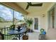 Enjoy beautiful views from this screened balcony with comfortable outdoor seating at 7155 Boca Grove Place Pl # 202, Lakewood Ranch, FL 34202