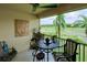 Relaxing screened balcony with a golf course view, perfect for outdoor enjoyment at 7155 Boca Grove Place Pl # 202, Lakewood Ranch, FL 34202