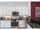 Well-equipped kitchen featuring granite countertops, stainless steel appliances, and ample cabinetry at 7155 Boca Grove Place Pl # 202, Lakewood Ranch, FL 34202