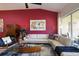 Comfortable living room featuring a plush L-shaped sofa, modern decor, and access to the outdoor space at 7155 Boca Grove Place Pl # 202, Lakewood Ranch, FL 34202