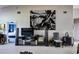 Bright living room featuring modern furniture, sleek entertainment center, and neutral color scheme at 7155 Boca Grove Place Pl # 202, Lakewood Ranch, FL 34202