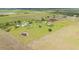 Wonderful aerial shot of the farm with a pond at 7745 Wauchula Rd, Myakka City, FL 34251