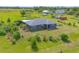 A gray single-story home with a simple, landscaped yard in a rural environment at 7745 Wauchula Rd, Myakka City, FL 34251