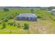 Cozy home with a serene rural setting, spacious front lawn and lovely landscaping at 7745 Wauchula Rd, Myakka City, FL 34251