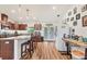 Bright kitchen featuring dark cabinets, granite countertops, stainless appliances and an island with barstool seating at 7745 Wauchula Rd, Myakka City, FL 34251