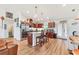Kitchen featuring stainless steel appliances, granite countertops, and a center island with seating at 7745 Wauchula Rd, Myakka City, FL 34251