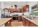 Kitchen with stainless steel appliances and granite countertops for cooking and entertaining at 7745 Wauchula Rd, Myakka City, FL 34251