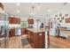 Well-lit kitchen featuring granite countertops, stainless steel appliances, and a convenient center island at 7745 Wauchula Rd, Myakka City, FL 34251