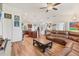 Open-concept living area with wood-look floors connecting the kitchen and living space at 7745 Wauchula Rd, Myakka City, FL 34251