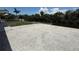Spacious crushed gravel backyard leads to dock and canal with view of the treeline at 808 25Th W Ave, Palmetto, FL 34221