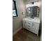 Bright bathroom features a white vanity with marble countertop and black fixtures at 808 25Th W Ave, Palmetto, FL 34221