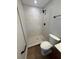 Updated bathroom features a sleek walk-in shower with neutral tiling and modern fixtures at 808 25Th W Ave, Palmetto, FL 34221