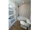 Bright bathroom features a tub and shower combo, tile surround, and updated fixtures at 808 25Th W Ave, Palmetto, FL 34221