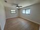 Spacious bedroom with tile floors, ceiling fan, and natural light from large windows at 808 25Th W Ave, Palmetto, FL 34221