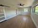 Bedroom featuring modern sliding door, ample windows, and tile flooring for easy maintenance at 808 25Th W Ave, Palmetto, FL 34221
