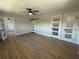 Bedroom with tile floors, a modern sliding door, and three panel doors leading to different areas at 808 25Th W Ave, Palmetto, FL 34221
