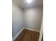 Walk-in closet with wood-look tile flooring, trim, and neutral paint in this single Gathering home at 808 25Th W Ave, Palmetto, FL 34221